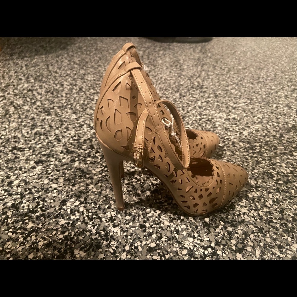 Tan heels with cut out design.
